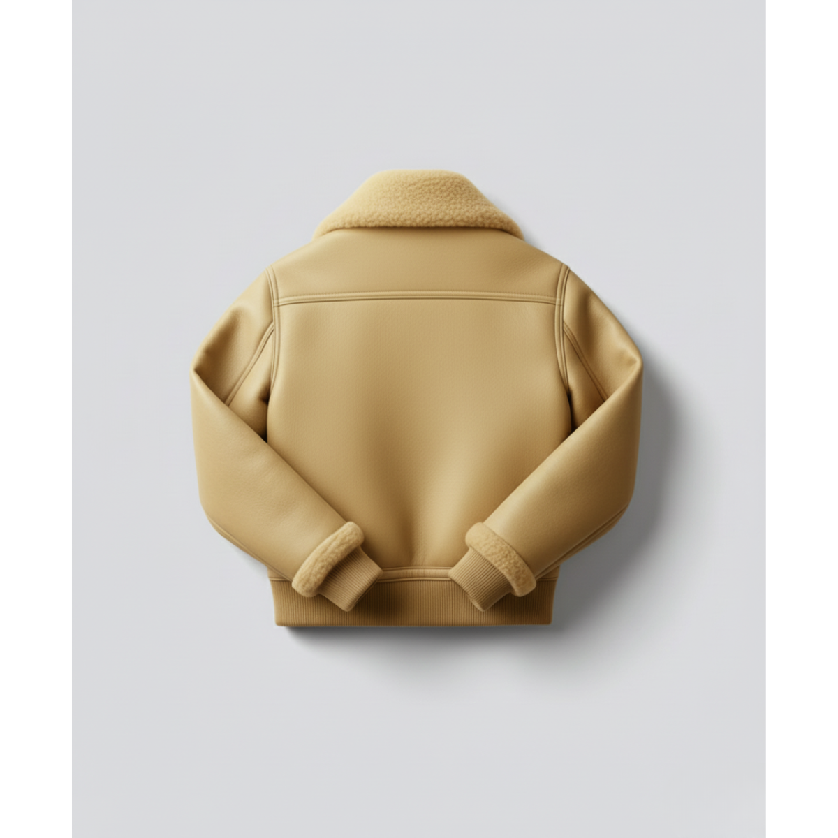 Back view of The Silk Route Leather Shearling Jacket, showcasing the smooth camel-colored leather back panel and the thick shearling collar and cuffs. The back features subtle yoke stitching and a comfortable ribbed hem.